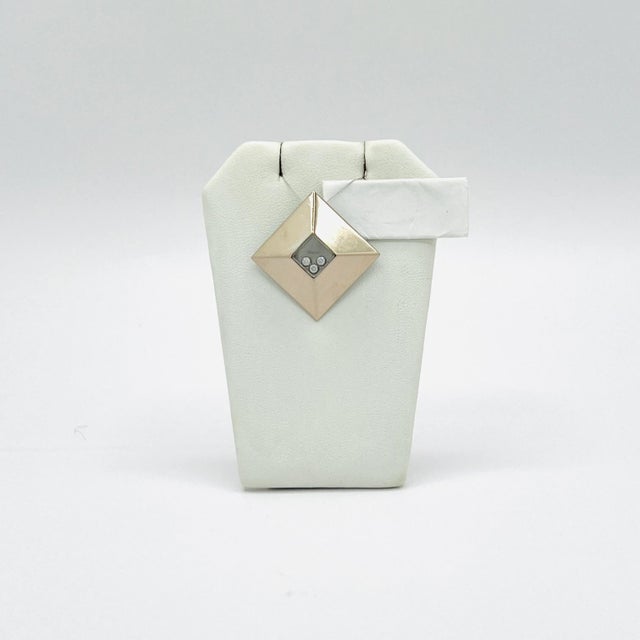 Beautiful estate Chopard earring, ring and pendant set with floating white diamond rounds.