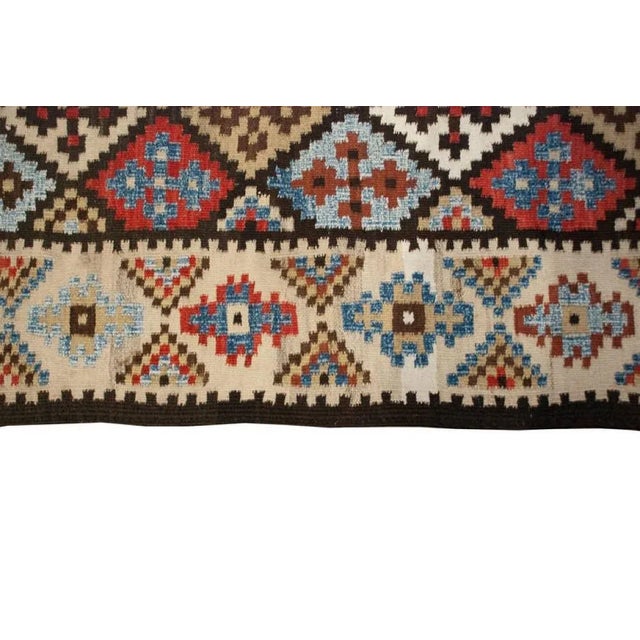 An early 20th Century Persian Saveh Kilim rug with wonderful all-over multicolored diamond pattern surrounded by a...
