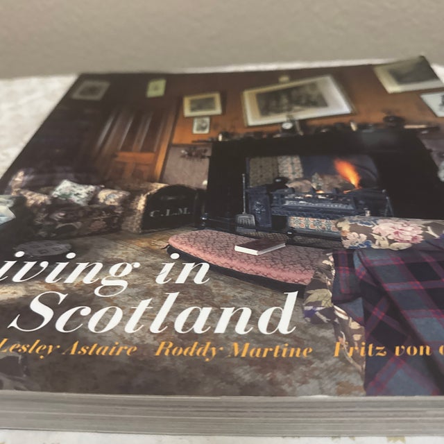 Beautiful softcover coffee table book titled Living in Scotland. Showcases stunning interiors, traditional Scottish homes,...