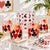 A vintage set of cocktail glasses with poker suit graphics, and a matching ice bucket.