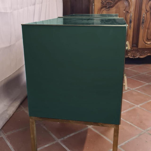 Elegant Night Stands in Dark Green Glass with Brass Trim These stunning nightstands feature exquisite dark green glass,...