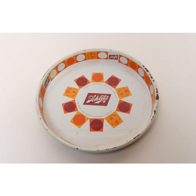 Vintage Schlitz matte enamel over metal beer tray (ca. 1968, USA). Attractive color combination of burgundy, orange, and...