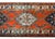 A bold early 20th century Persian Malayer runner with several diamond medallions against a crimson background and...