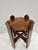 A classic Arts and Crafts or Mission style plant stand. This mahogany plant stand features a carved stretcher at the base....