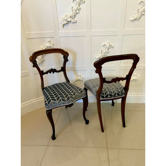 Pair of antique Victorian quality carved rosewood side chairs having a quality carved rosewood balloon back with a shaped...