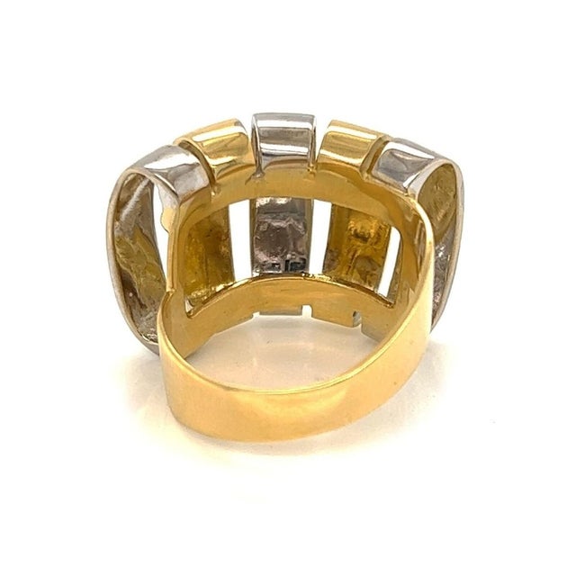 Crafted with sophistication, this Modern 18k Two Tone Gold Open Wide Band Ring is a testament to contemporary design and...