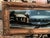 The product is an antique large fancy frame with a reverse-painted picture of a Catholic Church at an evening Mass out...