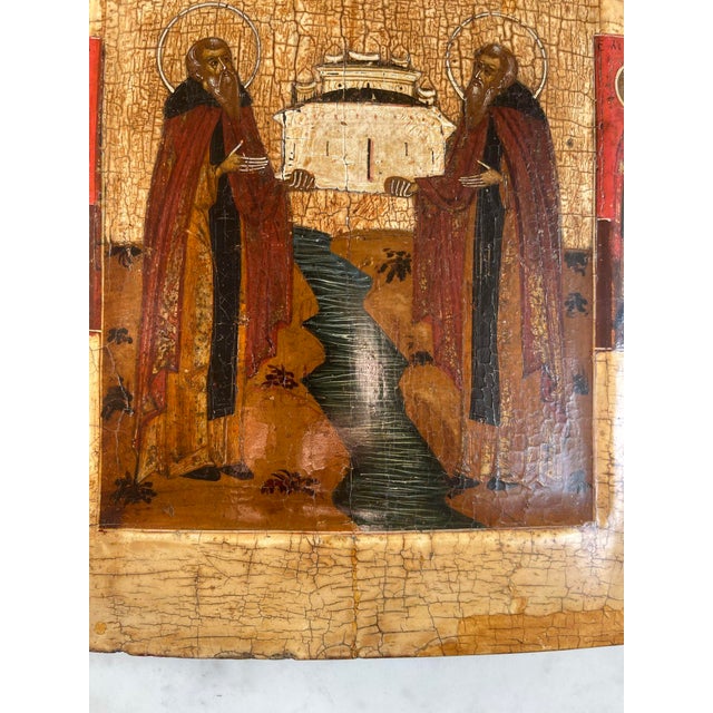 This 19th-century Russian icon features St. Zossima and St. Savvati of the Solovetsky Monastery. The saints are depicted...