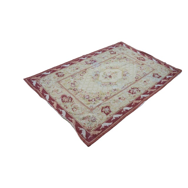 Vintage floral rose needlepoint textile rug featuring burgundy / red, green, pink, tan and light gray / blue. Dimensions:...