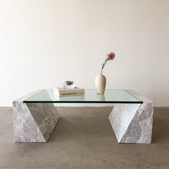 A vintage 1980s Postmodern marble coffee table with a sculptural form, consisting of two marble base pieces and a new...