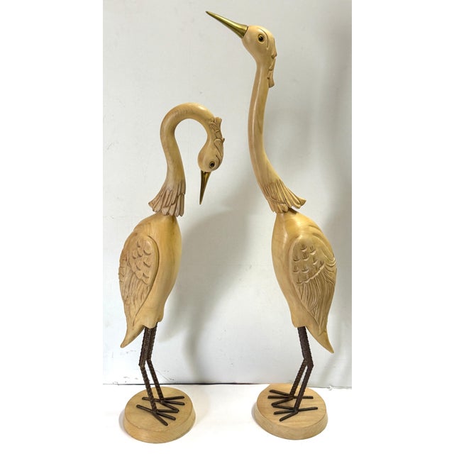 Pair of Italian Hollywood Regency Carved Wood, Brass & Iron Heron Sculptures Italy, circa 1970s–1980s A striking and...