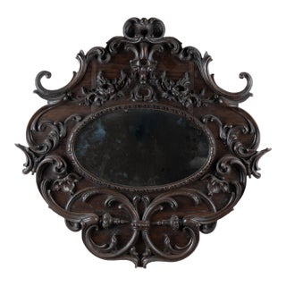 Early 20th Century Carved Oval Dark Oak Mirror From Portugal For Sale