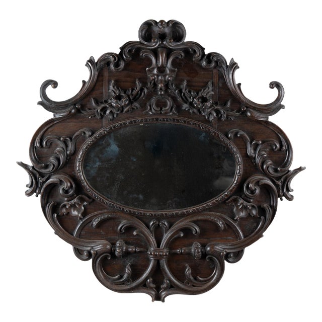 Early 20th Century Carved Oval Dark Oak Mirror From Portugal For Sale
