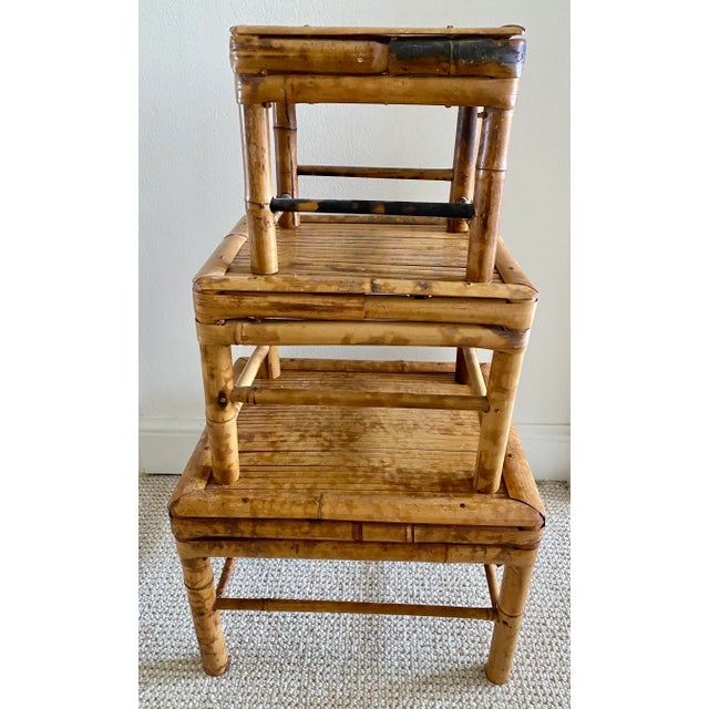 Great looking set of 3 vintage bamboo nesting tables/plant risers. Can be used for plants or vases. Graduated heights.