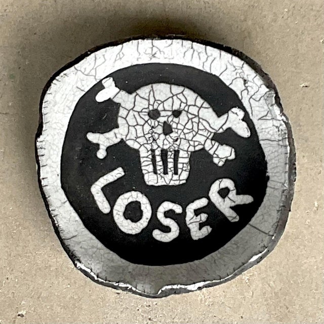 This bold and edgy vintage studio pottery bowl, created and signed by C. Heck, makes a daring statement with its "Loser"...