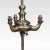 Very unusual silvered standard lamp, the central circular column having rise and fall three-light candelabra. All raised...