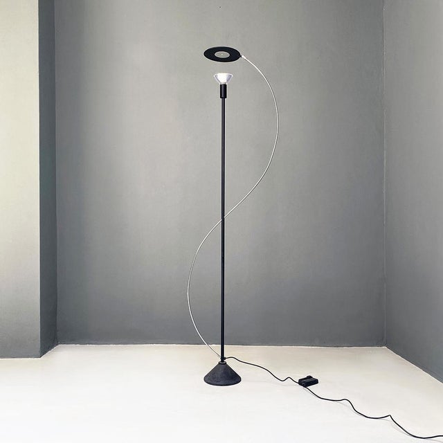 Italian post modern black metal and steel floor halogen floor lamp, 1980s. Floor lamp with conical base, central black...
