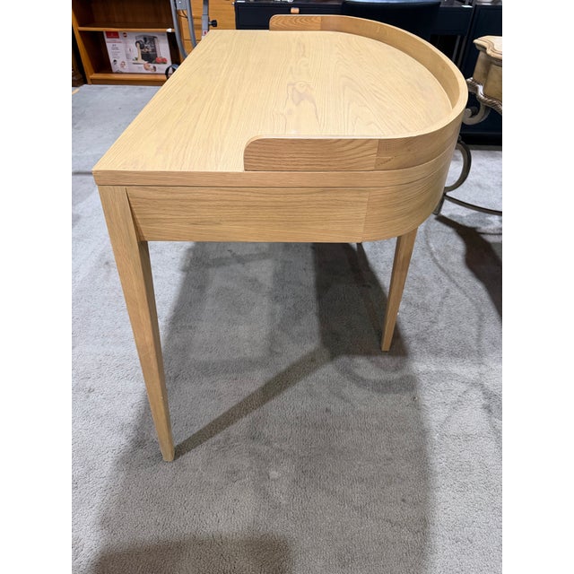 Clean, modern design meets everyday functionality in this beautifully crafted Four Hands “Armstrong” writing desk....
