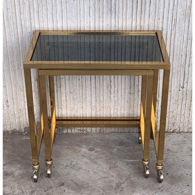 Metal Nesting Tables Italian Design 1970 in Brass With Smoked Glass and Wheels - a Pair For Sale - Image 7 of 11