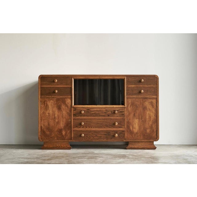 Art Deco Cabinet in Oak, Sweden, 1940s. Very distinct Art Deco cabinet with glass sliding doors, well executed in oak, oak...