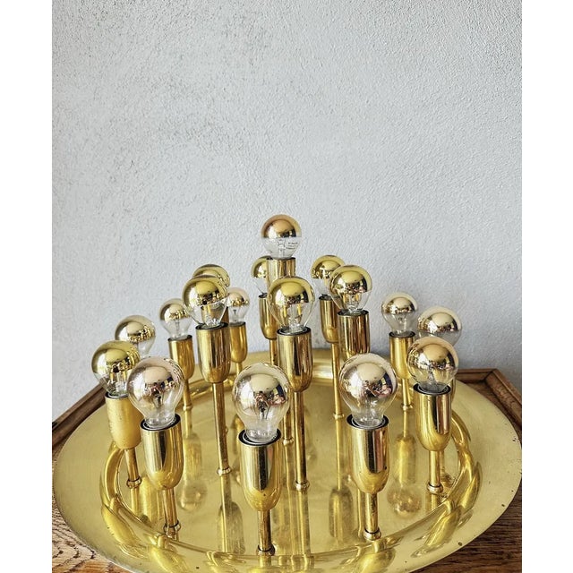Beautiful Mid - Century design. 1970s German ceiling or wall lamp. Round brass base with 19 lampholders at 3 different...