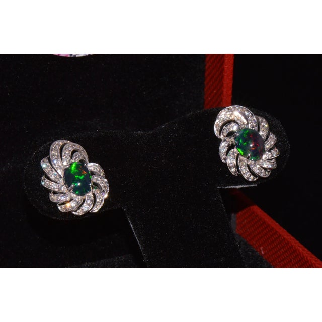 Gorgeous large retro opal and diamond domed swirl earrings. These earrings feature a stunning domed design with a large...