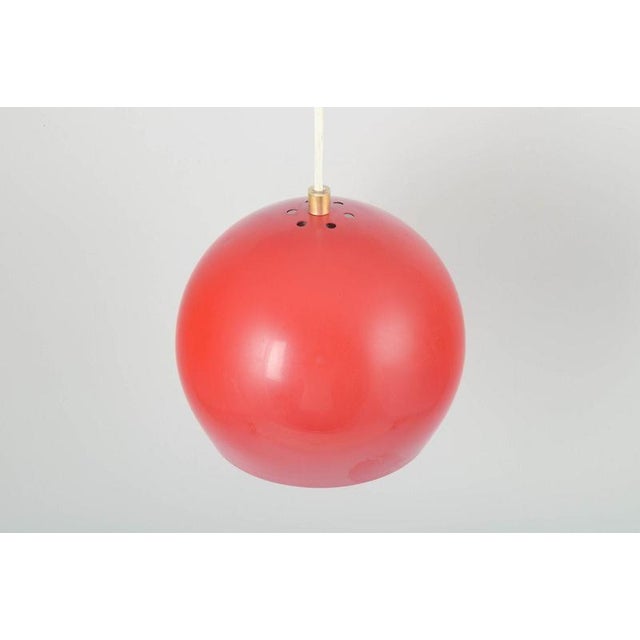 Verner Panton for Louis Poulsen, Denmark. Topan pendant lamp in red lacquered metal. Model designed by Verner Panton in...