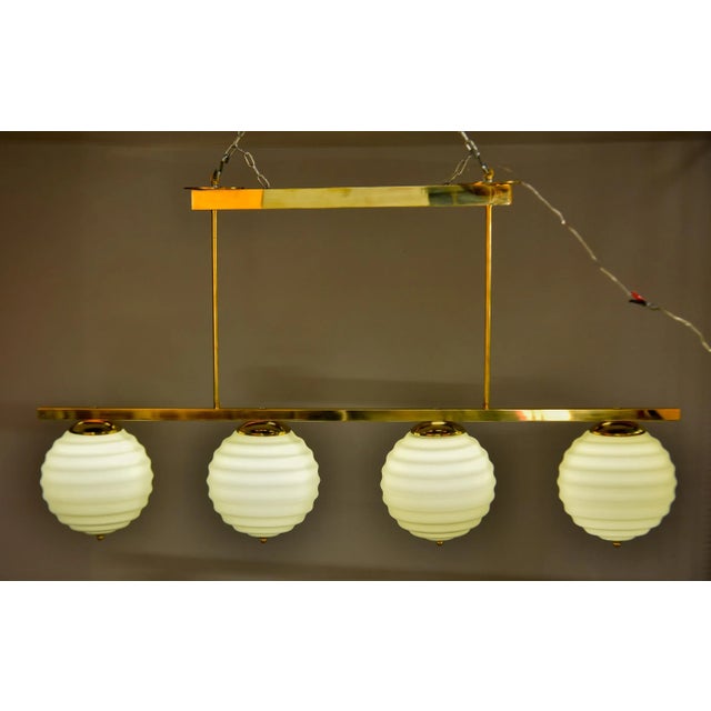 New Italian Fixture With 4 Pale Taupe Globes on Horizontal Brass Bar For Sale - Image 11 of 12