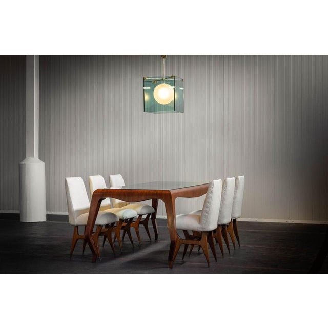 A refined set of six dining chairs designed by Melchiore Bega in Italy during the 1950s. These chairs are a clear...