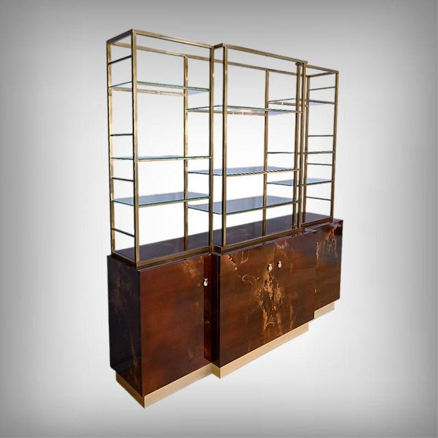 Rare and exceptional, this bookcase, attributed to the French designer Guy Lefevre for the prestigious Maison Jansen,...
