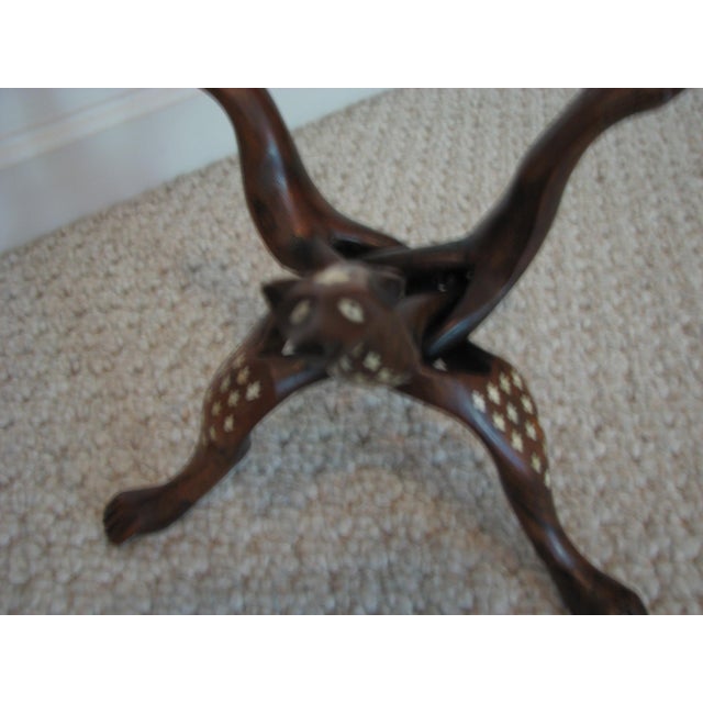 Exceptional 1930s Hand‑Carved Rosewood Snake Tripod Stand with Bone Inlay and Detailed Serpent Heads A rare and...