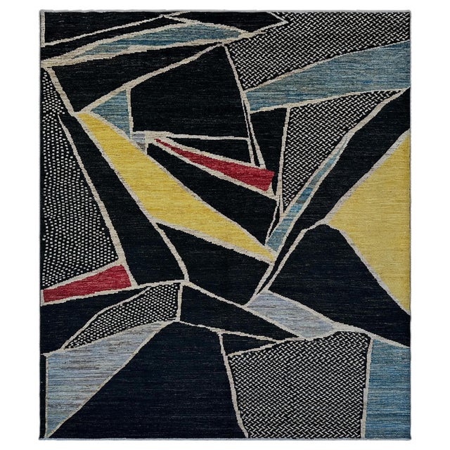 A floor-scale Cubist composition. Charcoal black planes shatter into angular shards across the field, each edge traced in...