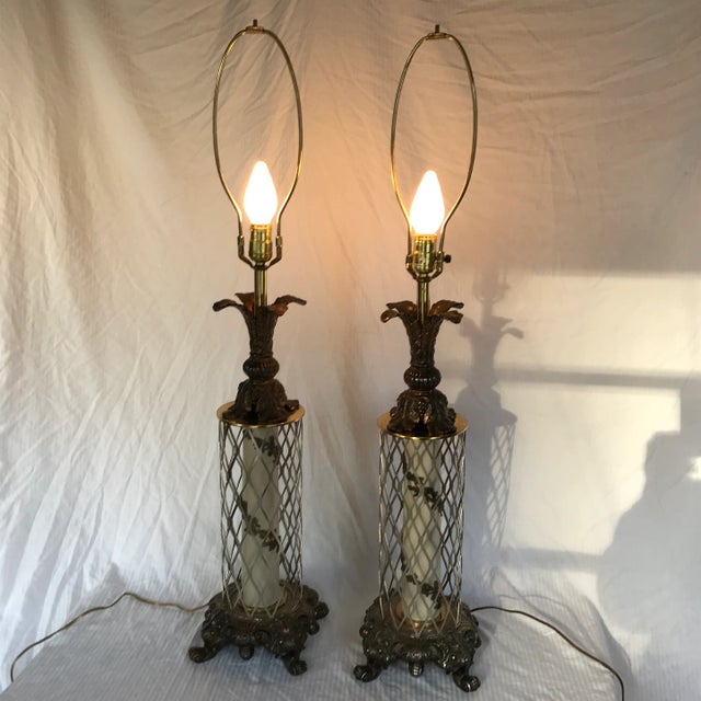 Diamond cut metal around a metal raised spiral fleurish decor in the center of lamp. Heavy bottom metal scroll base and...