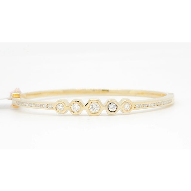 Beautiful bangle with 0.60 ct. good quality white diamond rounds. Handmade in 14k yellow gold. Metal: Yellow Gold Stone:...