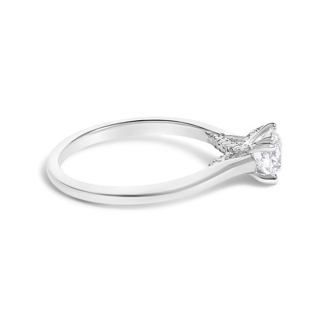 Embrace timeless elegance with this exquisite 14K white gold engagement ring, radiating sophistication and luxury....