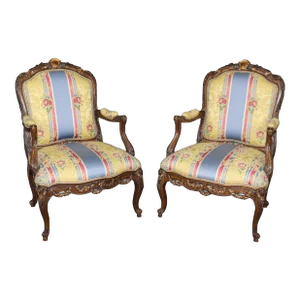 Pair of Elaborately Carved Gilt Decorated Walnut Louis XVI Decorative Armchairs