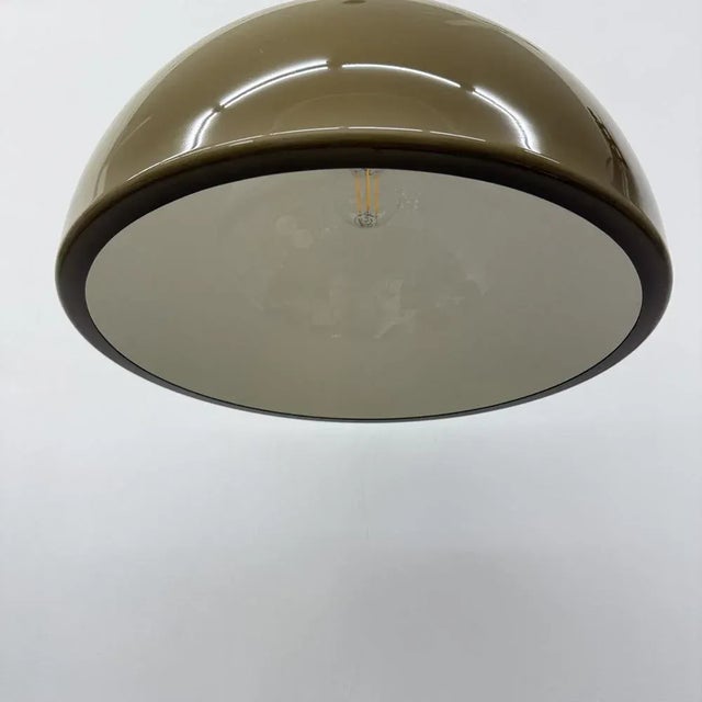 Brown Mushroom Pendant, 1970s, in Good conditions. Designed 1970 to 1979 Up to 250V (Europe/UK Standard).The wiring of...