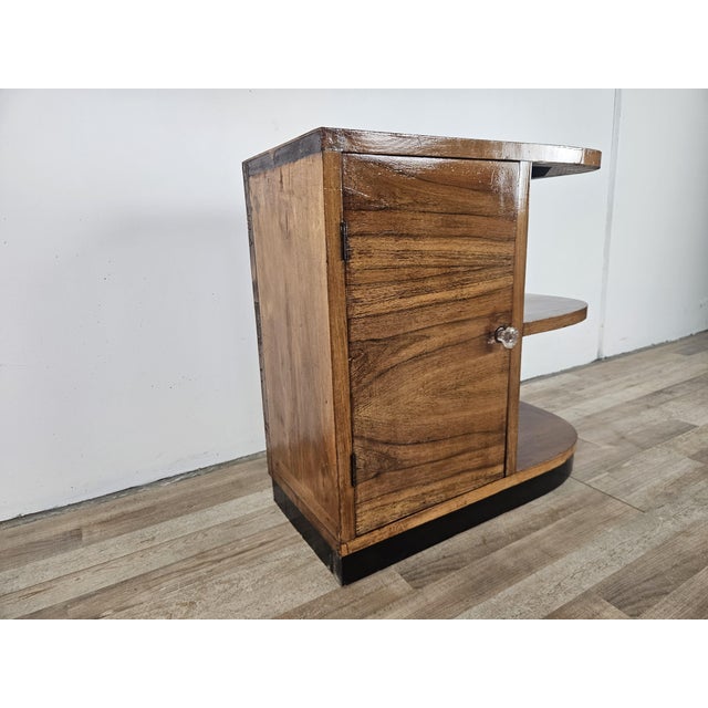 This 1940s Art Deco cabinet is ideal for use in an entryway, next to a sofa, or in the living room. It features a double...
