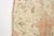 This is a vintage Turkish Oushak rug from the Mid 20th Century. The piece was hand-knotted.