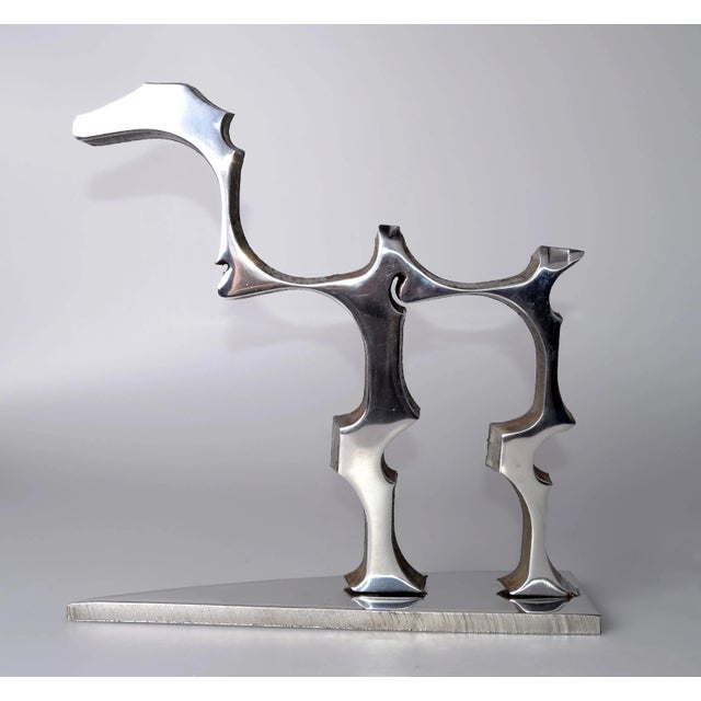 Amazing stainless steel table dinosaur sculpture. One-of-a-kind craftsmanship with the Industrial Look. No signature....