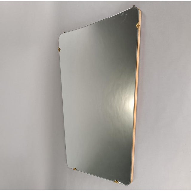 Large Gio Ponti-style mirror, Italian design from the 1950s. Wooden base, original antique mirror, brass supports....