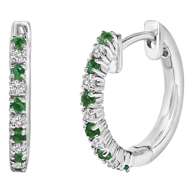 10K White Gold Alternating Emerald 1/10 Cttw Diamond Huggy Hoop Earrings (I-J Color, I1-I2 Clarity) For Sale