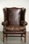 This vintage English-style wingback chair is made of grained cowhide leather and features a comfortable seat. It is...