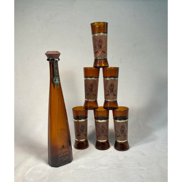 Vintage Mid Century Modern set of Siesta Ware, Conquistador. Amber drinking glasses with genuine walnut wood sleeves. The...