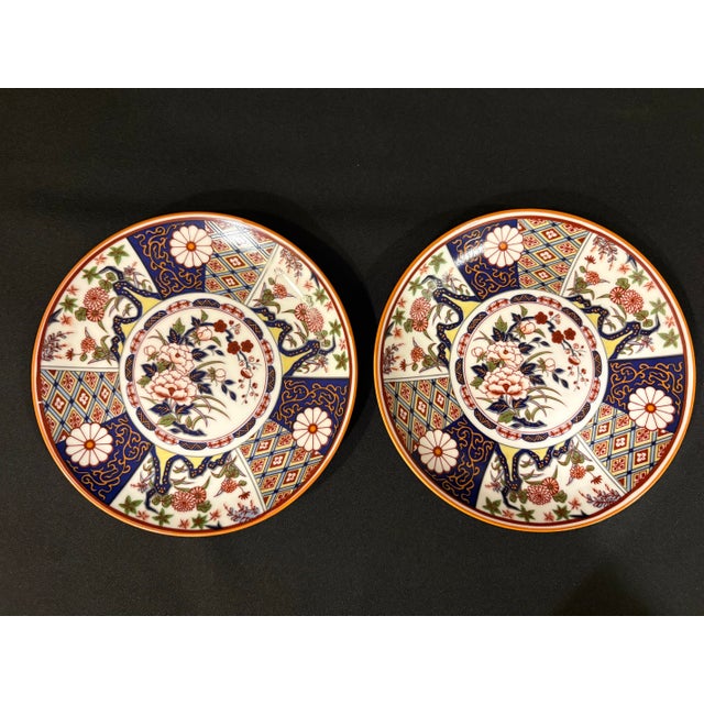 Colorful set of four pairs of dessert plates in the traditional Imari style themes. Fine white porcelain manufactured by...