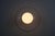 Italian wall lamp or flush mount from the 1960s with a clean white disc-shaped base and a central opaline glass globe. The...