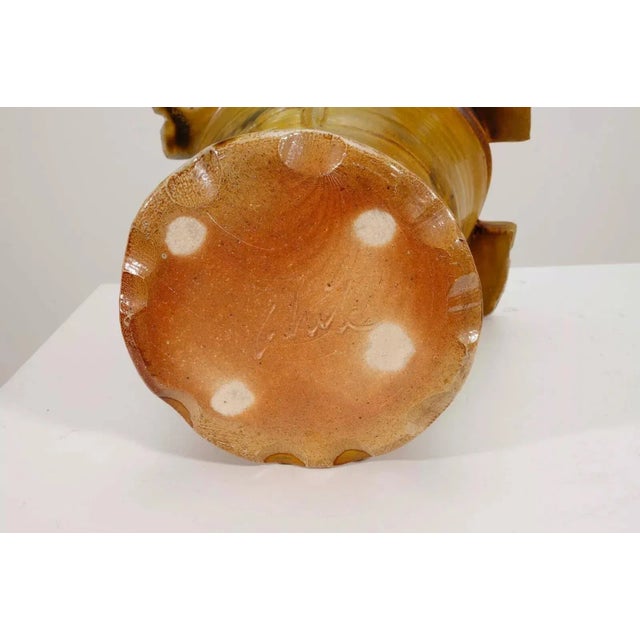 A modernist stoneware glazed rare ceramic vase by Detroit artist John Glick of Plum Tree Pottery. Circa late 20th century....
