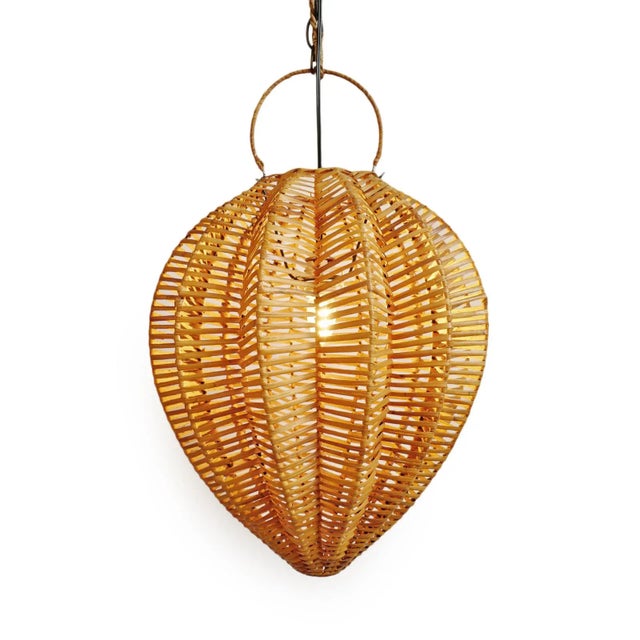 Honey stained rattan starfruit lantern. Beautiful natural material and organic shape. Each lantern may have slight...