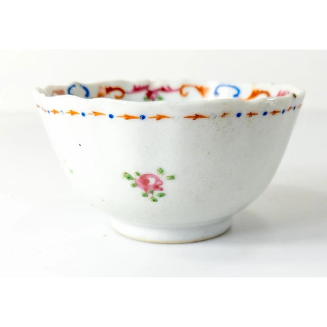 We are selling this simply decorated 18th or 19th century Chinese export porcelain teacup with simple floral decoration,...