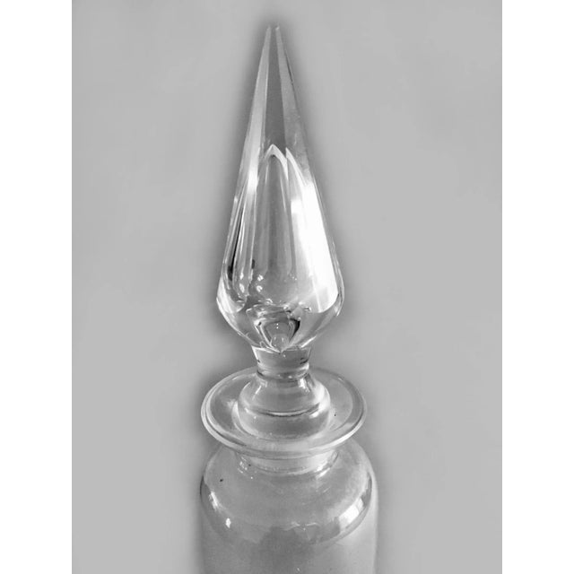 Cut crystal apothecary pharmacy jar with cut crystal base and finial stopper.